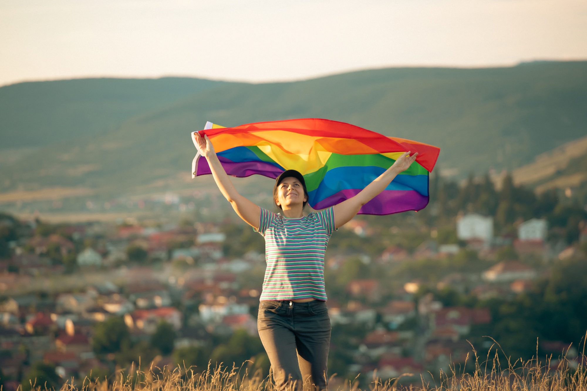 Young woman with LGBT flag.