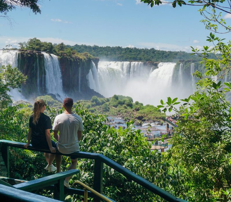 Man and woman looking at the Iguazu waterfalls