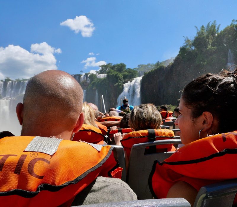 People from behind wearing lifesaving vest